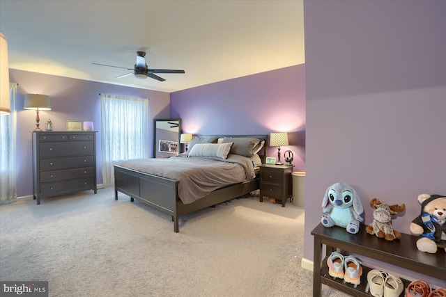 bedroom featuring ceiling fan, carpet flooring, and baseboards