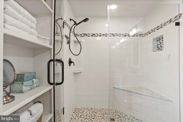 full bath with a shower stall