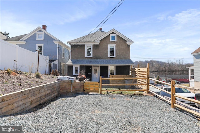 view of front of property with a shingled roof