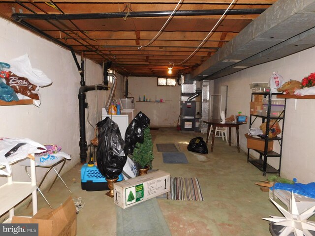 basement with water heater and heating unit