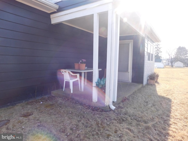 view of property exterior featuring a patio area