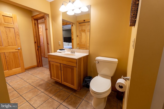 bathroom with tile patterned floors, connected bathroom, and toilet