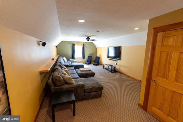 living room with light carpet, lofted ceiling, a ceiling fan, a textured ceiling, and baseboards