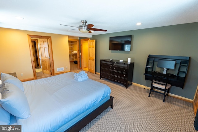 bedroom featuring visible vents, a walk in closet, recessed lighting, carpet, and baseboards