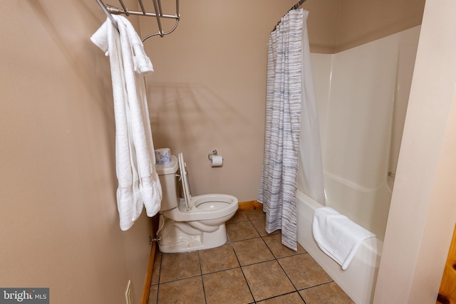 full bath with tile patterned floors, baseboards, toilet, and shower / bath combination with curtain