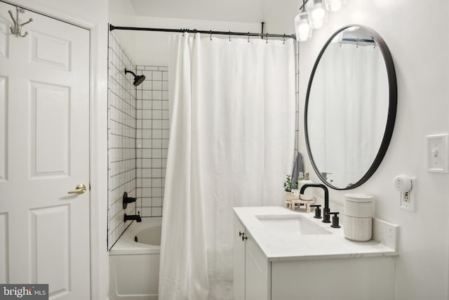 bathroom featuring vanity and shower / tub combo with curtain