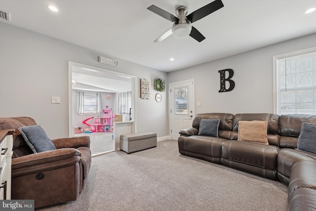 carpeted living room with baseboards, a ceiling fan, visible vents, and recessed lighting