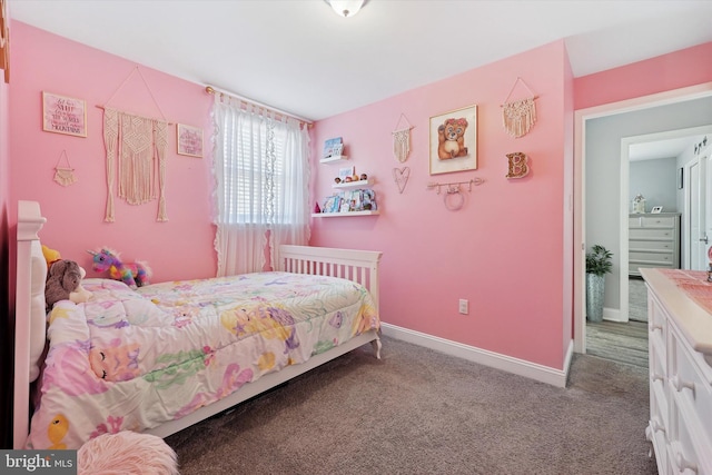 carpeted bedroom featuring baseboards