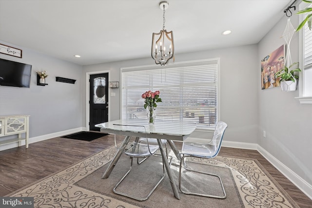 dining area with recessed lighting, dark wood-style flooring, a notable chandelier, and baseboards