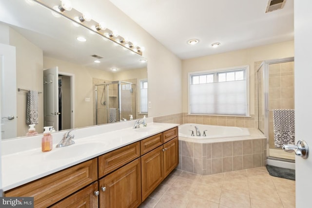 full bathroom with visible vents, a sink, a shower stall, tile patterned floors, and a bath