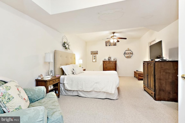 bedroom featuring light colored carpet and ceiling fan