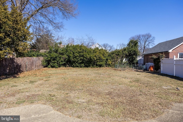 view of yard with fence