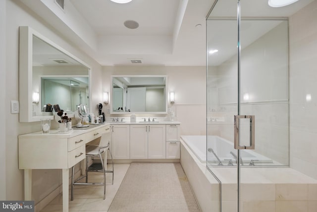 bathroom with tile patterned flooring, visible vents, a bath, and vanity