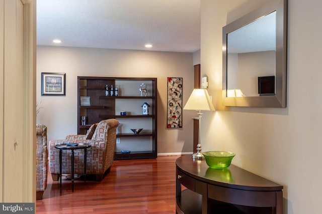 sitting room featuring recessed lighting, baseboards, and wood finished floors