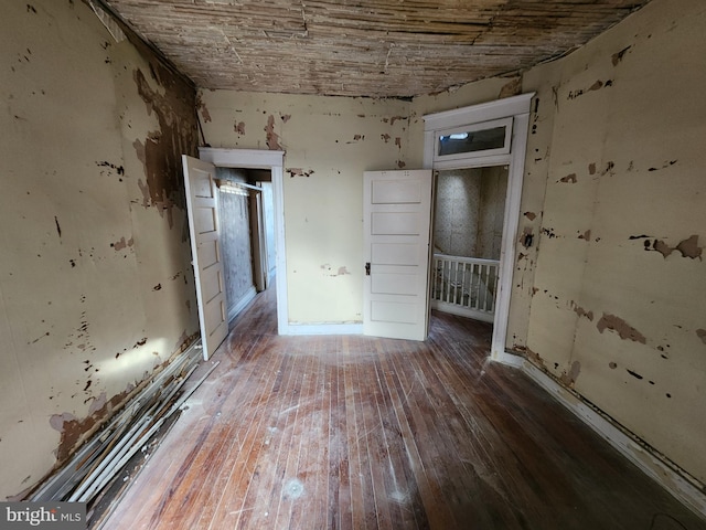 unfurnished room with wood-type flooring