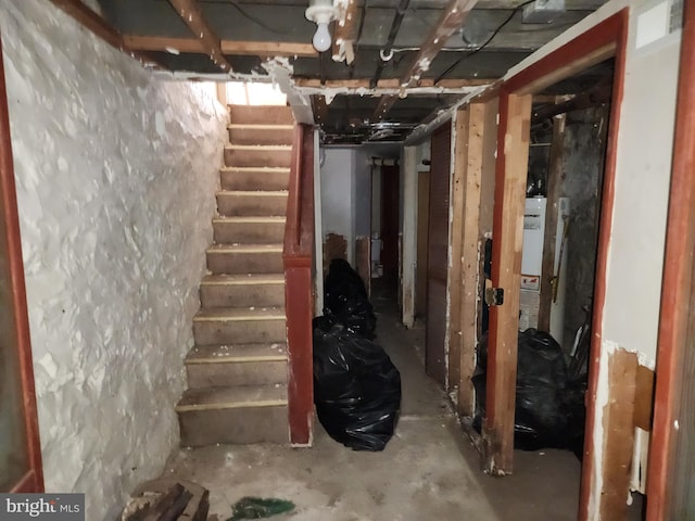 unfinished basement featuring stairway