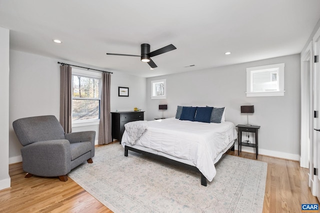 bedroom with visible vents, baseboards, a ceiling fan, light wood-style flooring, and recessed lighting