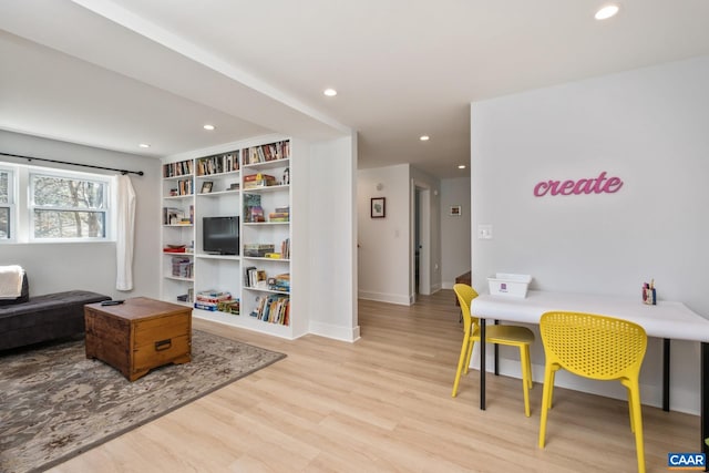 interior space featuring recessed lighting, light wood-style flooring, and baseboards