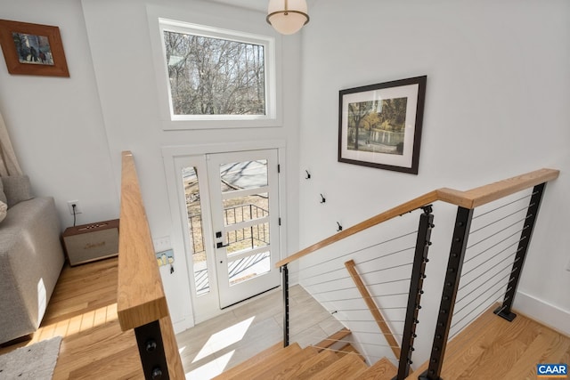 foyer featuring light wood-type flooring and baseboards