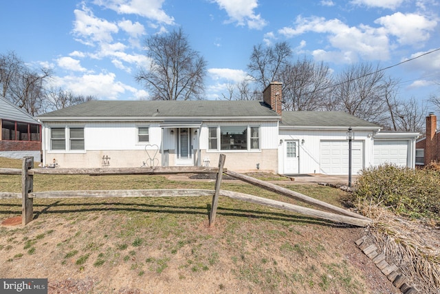 ranch-style house featuring an attached garage, brick siding, a fenced front yard, and a chimney