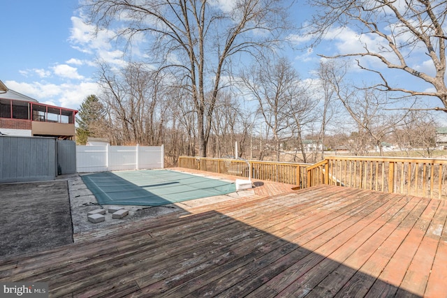 wooden terrace featuring fence