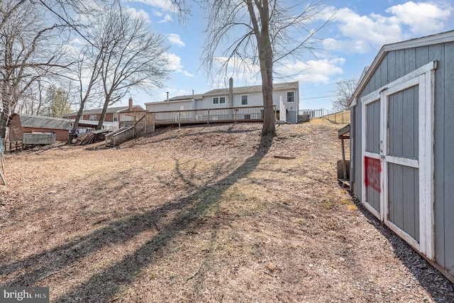 view of yard with a wooden deck