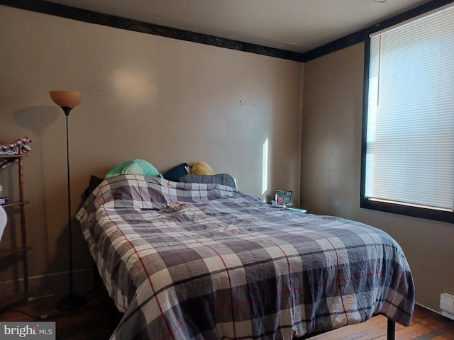 bedroom featuring wood finished floors