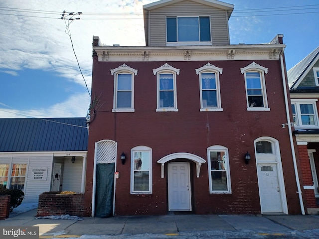 view of front of home featuring brick siding