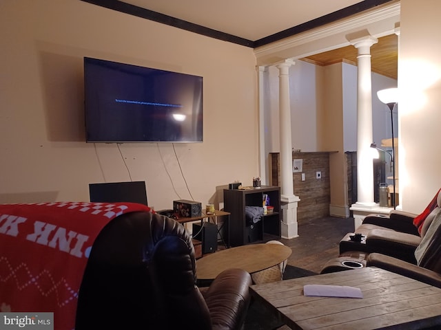 living area with crown molding and ornate columns