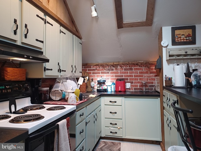 kitchen with dark countertops, white cabinets, range with electric stovetop, and under cabinet range hood