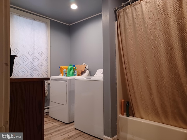 laundry room with recessed lighting, light wood-style floors, ornamental molding, separate washer and dryer, and laundry area