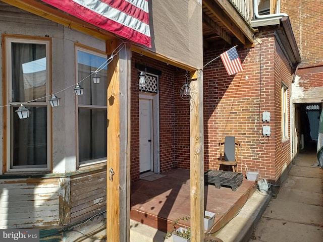 exterior space featuring brick siding