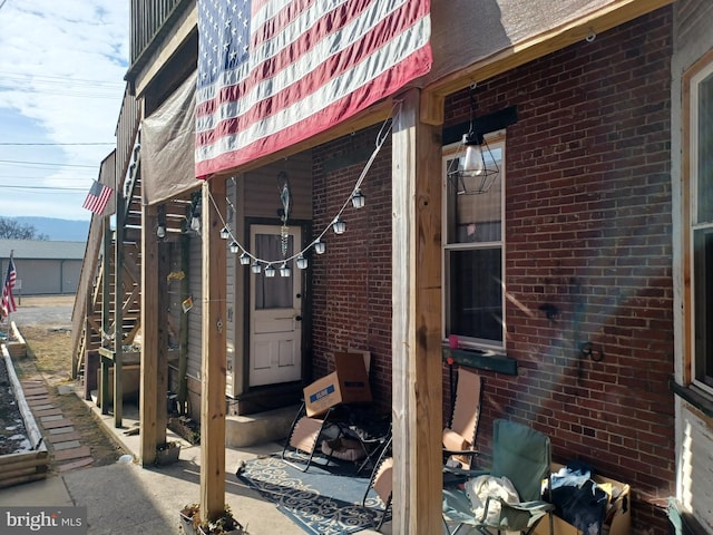 view of property exterior with brick siding