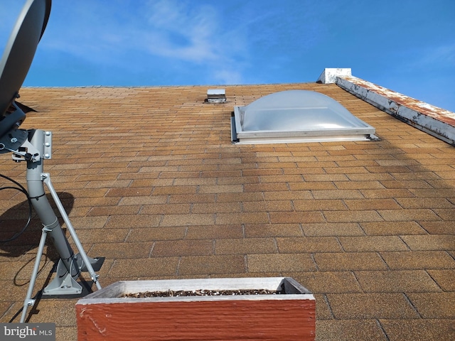 details featuring a shingled roof