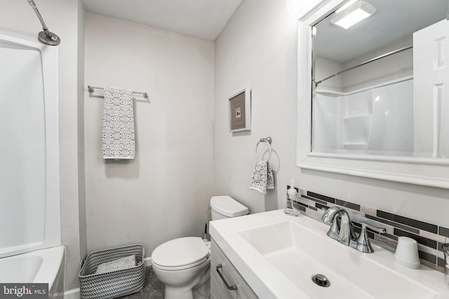 bathroom with toilet, a shower, decorative backsplash, and vanity