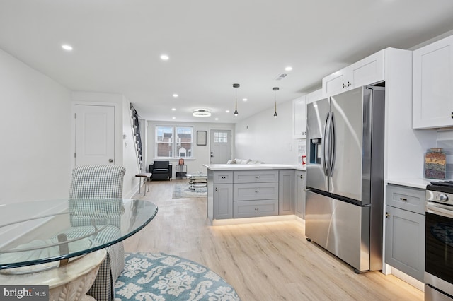 kitchen featuring gray cabinets, recessed lighting, light wood-style floors, appliances with stainless steel finishes, and a peninsula