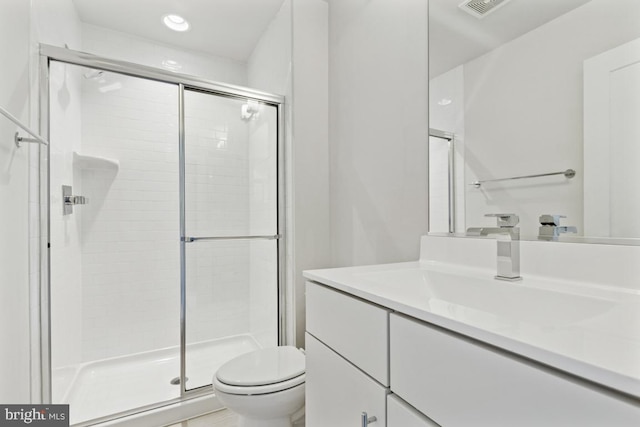 full bathroom with toilet, a shower stall, recessed lighting, and vanity