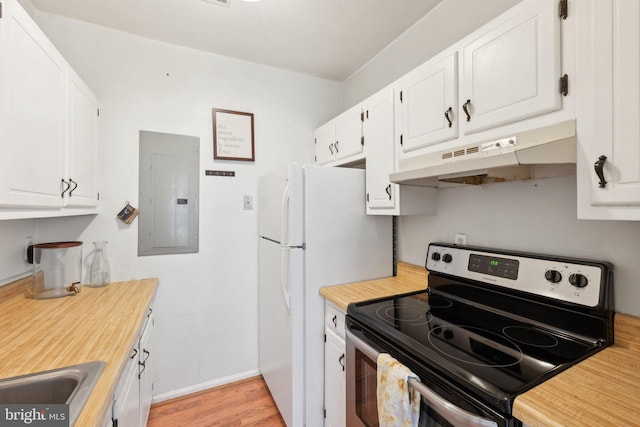 kitchen featuring under cabinet range hood, electric range, electric panel, and white cabinets