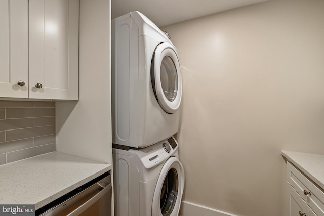 laundry area with laundry area and stacked washer and dryer