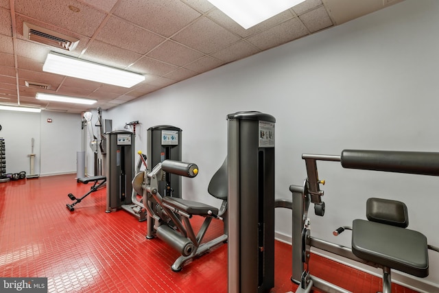 exercise room featuring visible vents and a paneled ceiling