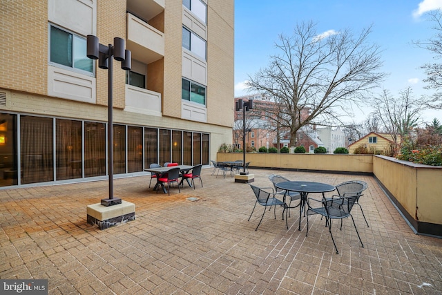 view of patio featuring outdoor dining area