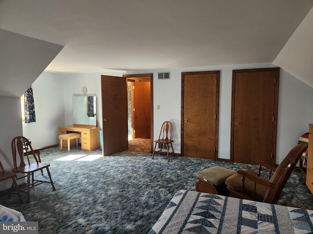 sitting room with lofted ceiling, carpet floors, visible vents, and baseboards