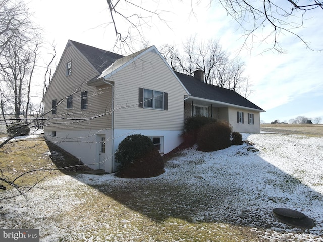 view of home's exterior featuring a chimney