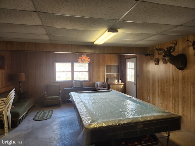 playroom with carpet, pool table, wooden walls, and a drop ceiling