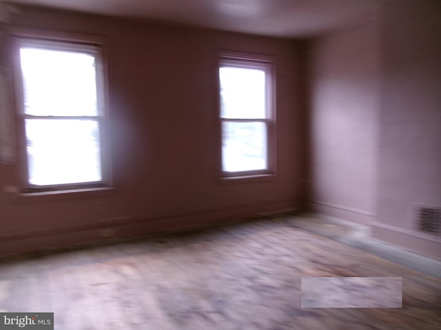 spare room featuring baseboards