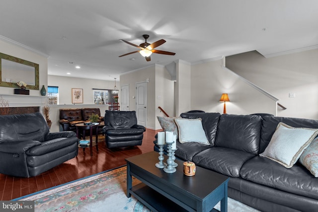 living room with a high end fireplace, crown molding, recessed lighting, and wood finished floors