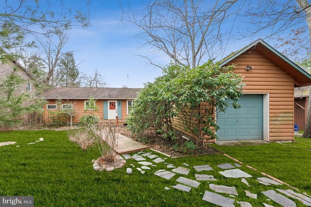 view of front of property featuring a front yard, faux log siding, and driveway