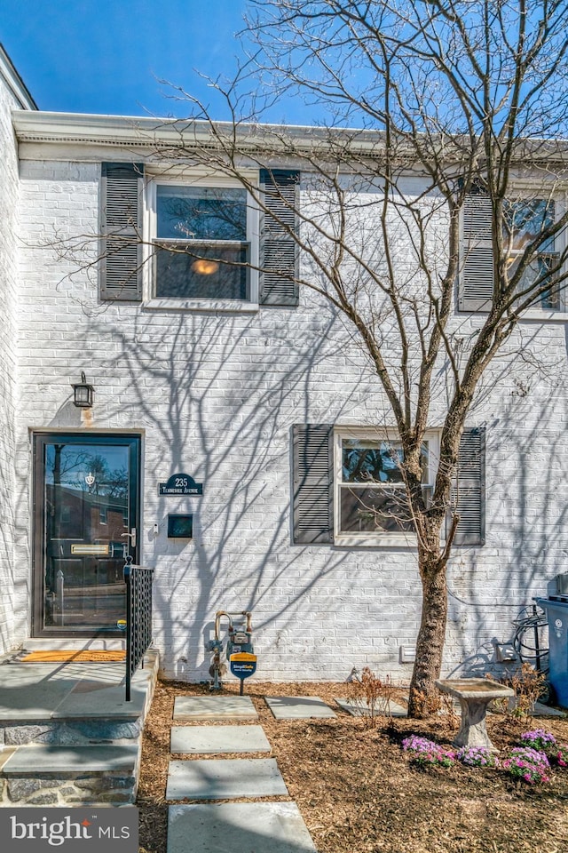 view of property exterior featuring brick siding