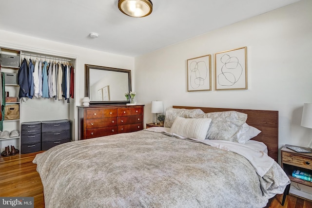 bedroom featuring a closet and wood finished floors