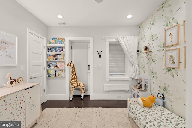 interior space featuring recessed lighting, visible vents, baseboards, and wood finished floors